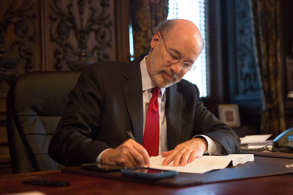 Pennsylvania Governor Tom Wolf signing a bill into law