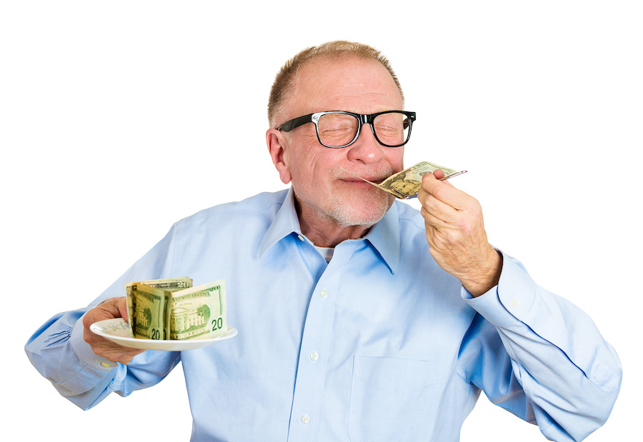 old man smelling money