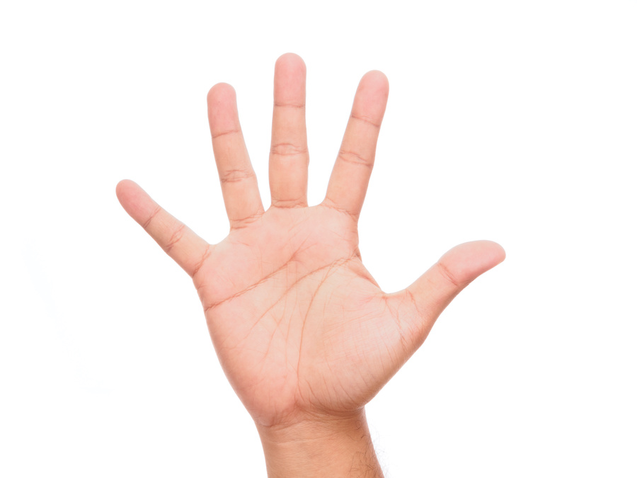 A human hand with all five fingers splayed