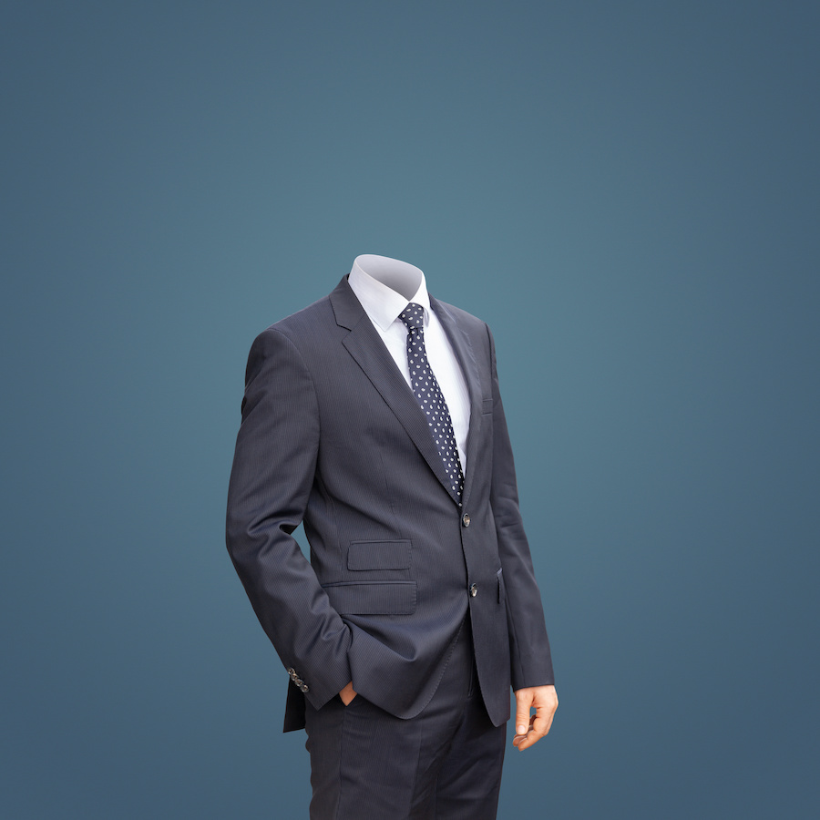 a headless man in a business suit