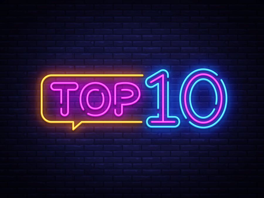 An illustration of the phrase "Top 10" rendered as if it were a neon sign against a brick background