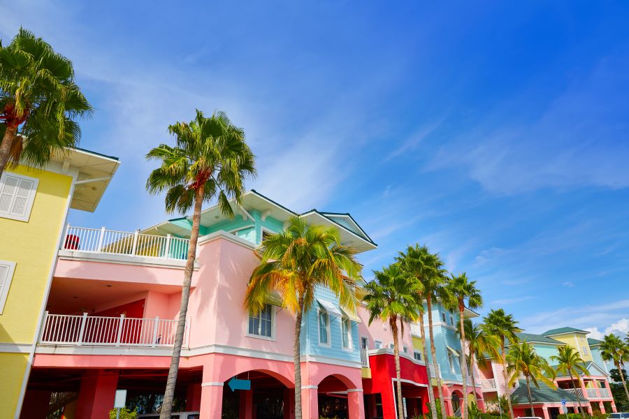 The colorful facades of buildings and palm trees in Fort Myers, Florida